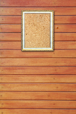 The photo frame on wood wallの写真素材