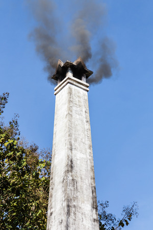 smoke stack on a blue sky の写真素材