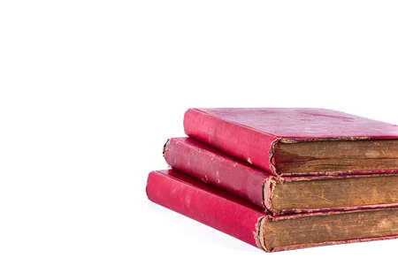 stack of red old book, isolated on white backgroundの写真素材