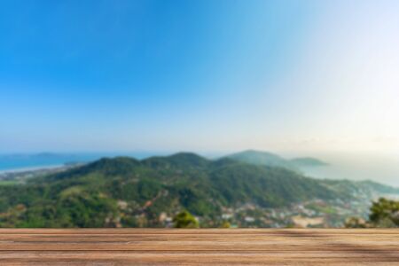 wooden table with scenic view background of Phuket town and landscape of island and sea view at...