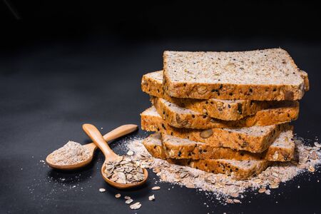 stack of whole wheat bread on black table