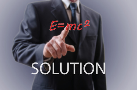 Businessman indicating the solution with his forefingerの写真素材