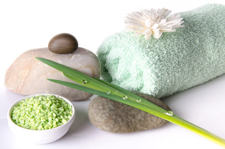Bath salt with a towel, isolated on whiteの写真素材