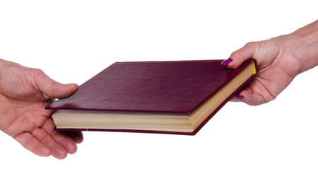 Woman's hand giving a book, isolated on white