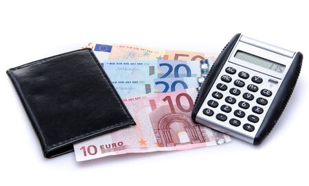Composition with banknotes, a wallet and a calculator, isolated on whiteの写真素材
