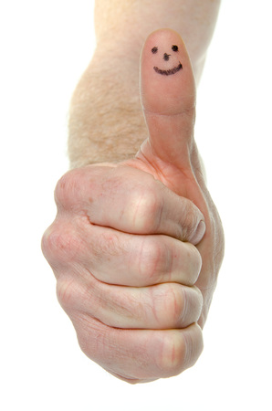 Positive sign with a thumb up, isolated on whiteの写真素材