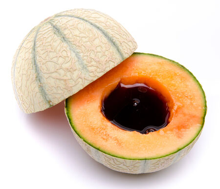 Melon with porto wine, isolated on whiteの写真素材