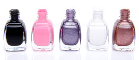 Line of nail polish bottles, isolated on whiteの写真素材