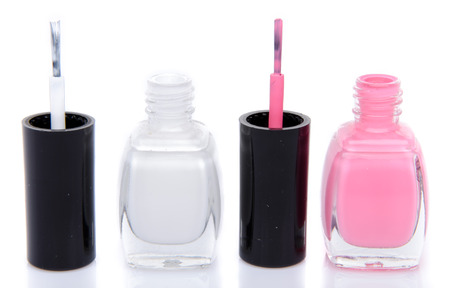 Two open nail polish bottles, isolated on whiteの写真素材