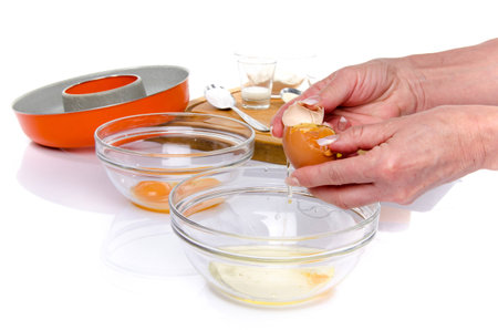 Preparation of a French ring cake, named savarin, isolated on whiteの写真素材