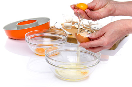 Preparation of a French ring cake, named savarin, isolated on whiteの写真素材