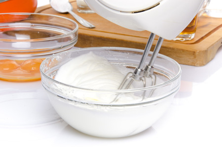 Preparation of a French ring cake, named savarin, isolated on whiteの写真素材