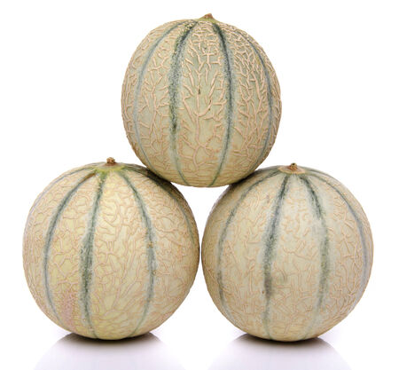 Composition with fresh melons, isolated on whiteの写真素材