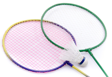 Badminton rackets and shuttlecock, isolated on whiteの写真素材