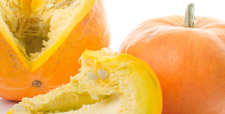 Nice big pumpkins cut into quarters, isolated on whiteの写真素材