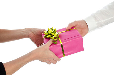 Man giving a present to a woman, isolated on whiteの写真素材