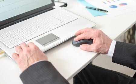 Businessman using a laptop at office