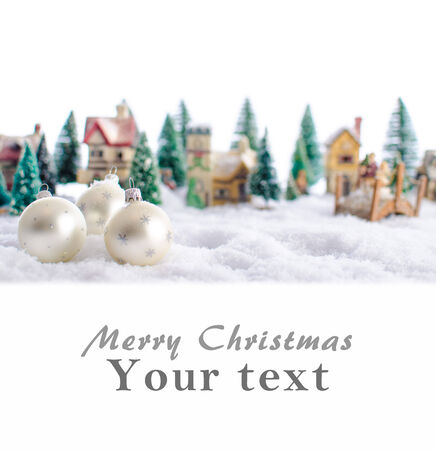 Christmas card showing a winter landscape with christmas ballsの写真素材