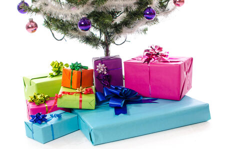 Presents under the Christmas tree, isolated on whiteの写真素材
