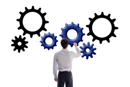 Businessman drawing gear wheels, isolated on whiteの写真素材