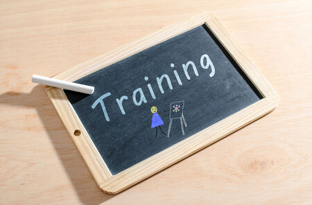 Training written on a blackboardの写真素材