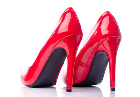 Red shoes with high heels, isolated on whiteの写真素材