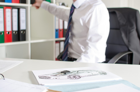 Car salesman at the dealership officeの写真素材