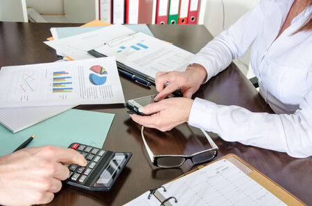 Two business people working together