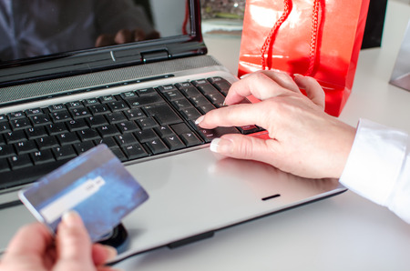 Woman making an online payment with a credit cardの写真素材