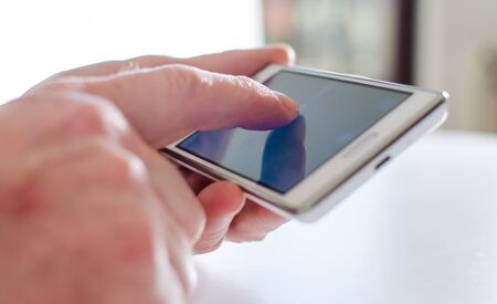 Using of a smartphone, closeup