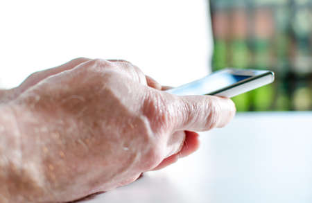 Using of a smartphone, closeup