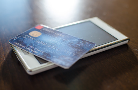 Credit card on smartphone, closeupの写真素材