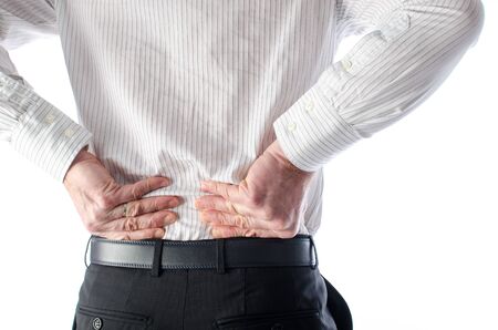Man with back pain, isolated on whiteの写真素材