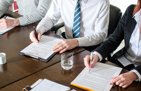 Business people taking notes during a training