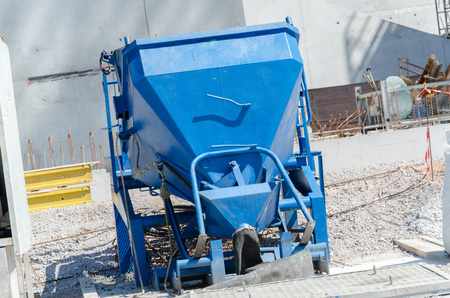 Concrete bucket for tower cranes on construction siteの写真素材