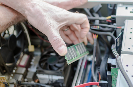 Technician repairing a computerの写真素材