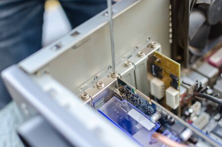 Technician repairing a computerの写真素材