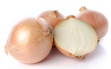 Fresh yellow onions, isolated on whiteの写真素材