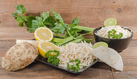 Tasty grated celery on wooden backgroundの写真素材