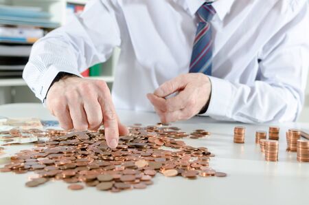 Businessman counting coins
