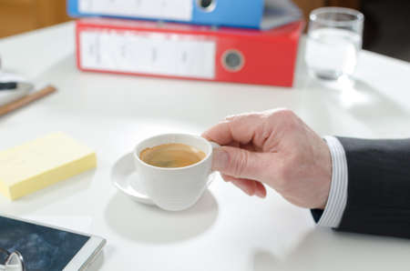 Businessman during a break drinking coffeeの写真素材