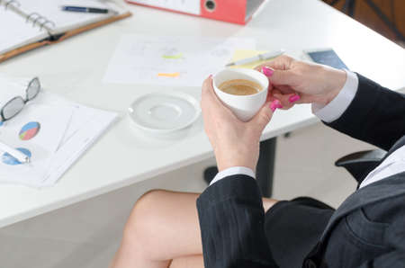 Businesswoman during a break drinking coffee