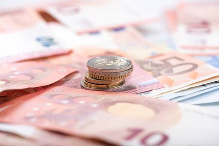 Background of euro banknotes and coinsの写真素材