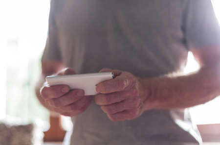 Man standing using his smartphone
