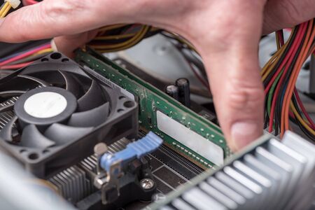 Hands installing ram memoryの写真素材