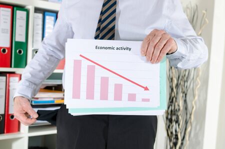 Businessman showing empty pocket because crisisの写真素材