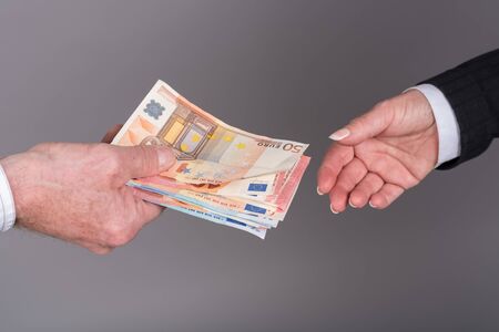 Hands transfering money
