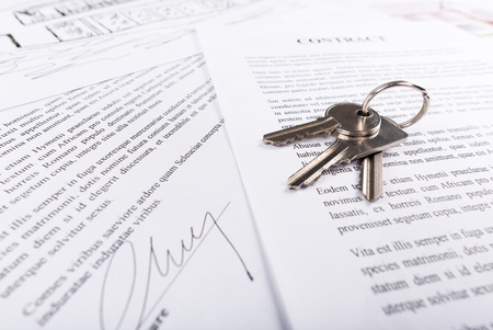 Real estate contract with keys (random latin dummy text used)の写真素材