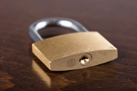Padlock on wooden backgroundの写真素材