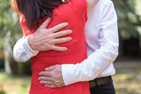Couple hugging with love in a parkの写真素材